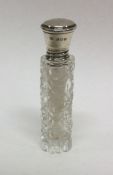 A silver mounted and cut glass scent bottle. Londo