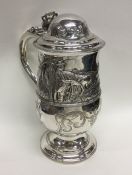 A good Georgian silver lidded tankard attractively