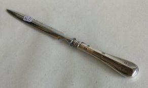 An Edwardian silver letter opener of typical form.