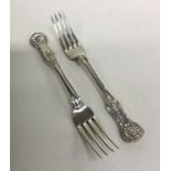 A heavy pair of Kings pattern silver dessert forks