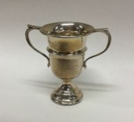 A small Edwardian silver trophy cup of shaped form