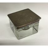 An Edwardian silver inkwell with engine turned top