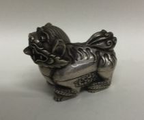 A heavy Chinese silver box in the form of a Dog of