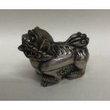 A heavy Chinese silver box in the form of a Dog of