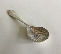 An Antique French silver caddy spoon with fluted b