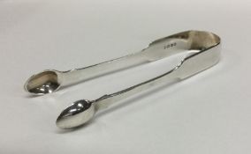 A good pair of fiddle pattern silver sugar tongs.