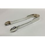 A good pair of fiddle pattern silver sugar tongs.