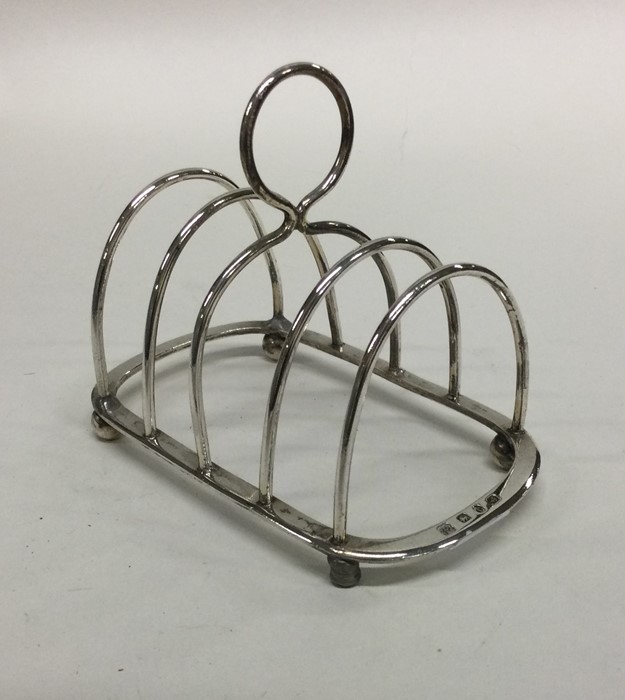 A silver four bar toast rack. Birmingham 1916. By - Image 2 of 2