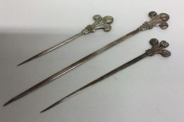 A graduated set of three silver plated meat skewer