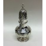 A good quality silver sugar caster of fluted desig