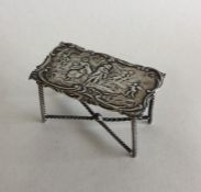 A novelty silver table toy in the form of a table