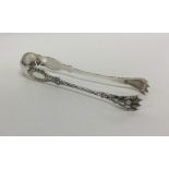 A good heavy pair of Antique silver ice tongs with