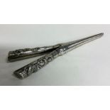 Chinese silver curling tongs mounted with dragons