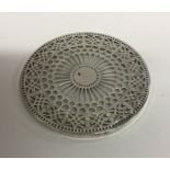 TIFFANY & CO: A circular silver and glass coaster