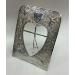 A heavy unmarked silver picture frame of Chinese d