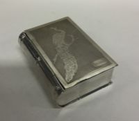 A large Japanese silver box in the form of a book