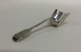 A heavy fiddle pattern silver sugar shovel. London