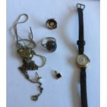 A small gold wristwatch together with other costum