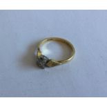 An 18 carat gold and diamond single stone ring. Ap