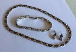 A heavy silver mesh necklace together with matchin
