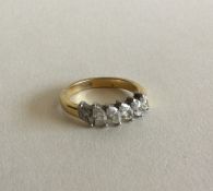 A good diamond six stone pear shaped ring in two c