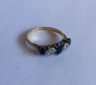 A good sapphire and diamond five stone half hoop r