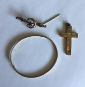 A 9 carat bangle together with a cross and brooch.