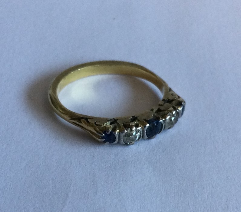 A sapphire and diamond five stone ring in carved 1 - Image 2 of 2