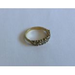 A good pear shaped diamond half hoop ring in 18 ca