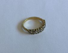 A good pear shaped diamond half hoop ring in 18 ca