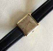 LONGINES: A gent's 18 carat gold wristwatch of squ