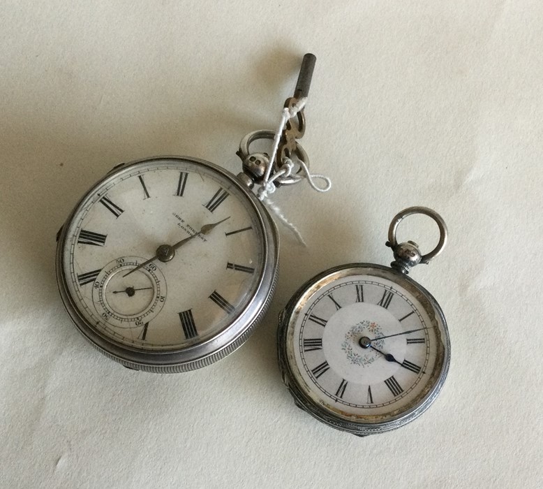 An engine turned silver pocket watch together with