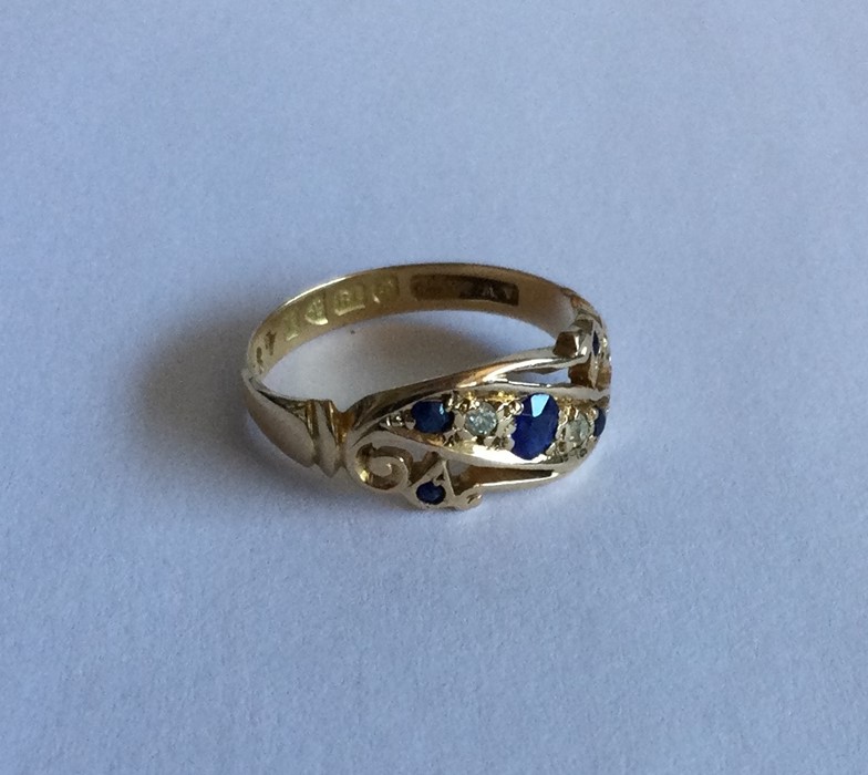 An 18 carat gold sapphire and diamond five stone b