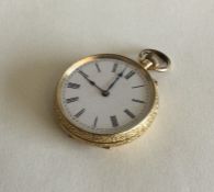 A 9 carat gold fob watch with white enamelled dial