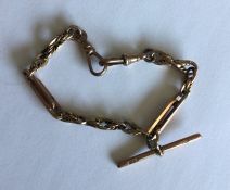 A 9 carat fancy link bracelet with bar. Approx. 17