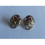 A pair of 9 carat ruby earrings of stylised form.