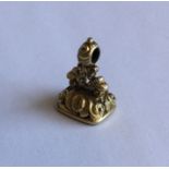 An Antique gold seal with chased decoration. Appro