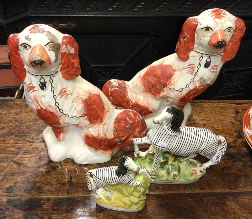 A tapering pair of Staffordshire zebras together w