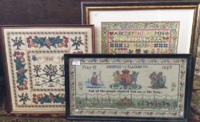 Three framed and glazed embroideries; one depictin