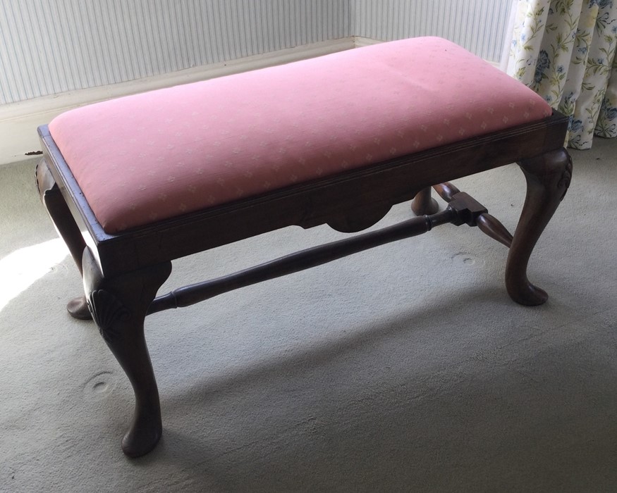 A mahogany duet stool with pink slip-in seat. Est.