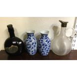 A pair of blue and white pottery vases together wi