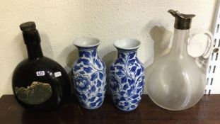 A pair of blue and white pottery vases together wi
