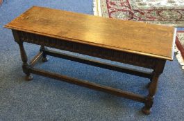 A good carved oak side table on turned supports wi