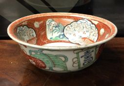 A Chinese circular bowl decorated in bright colour