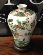 A Chinese baluster shaped vase decorated with flow