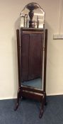 A mahogany dressing mirror on cabriole supports. E