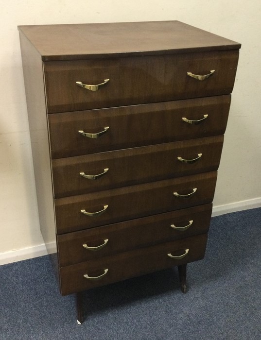 A slim retro six drawer chest on four spreading su