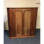 A large oak single door corner cupboard. Est. £30