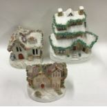 A group of three Staffordshire houses. Est. £30 -