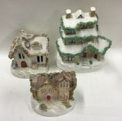 A group of three Staffordshire houses. Est. £30 -